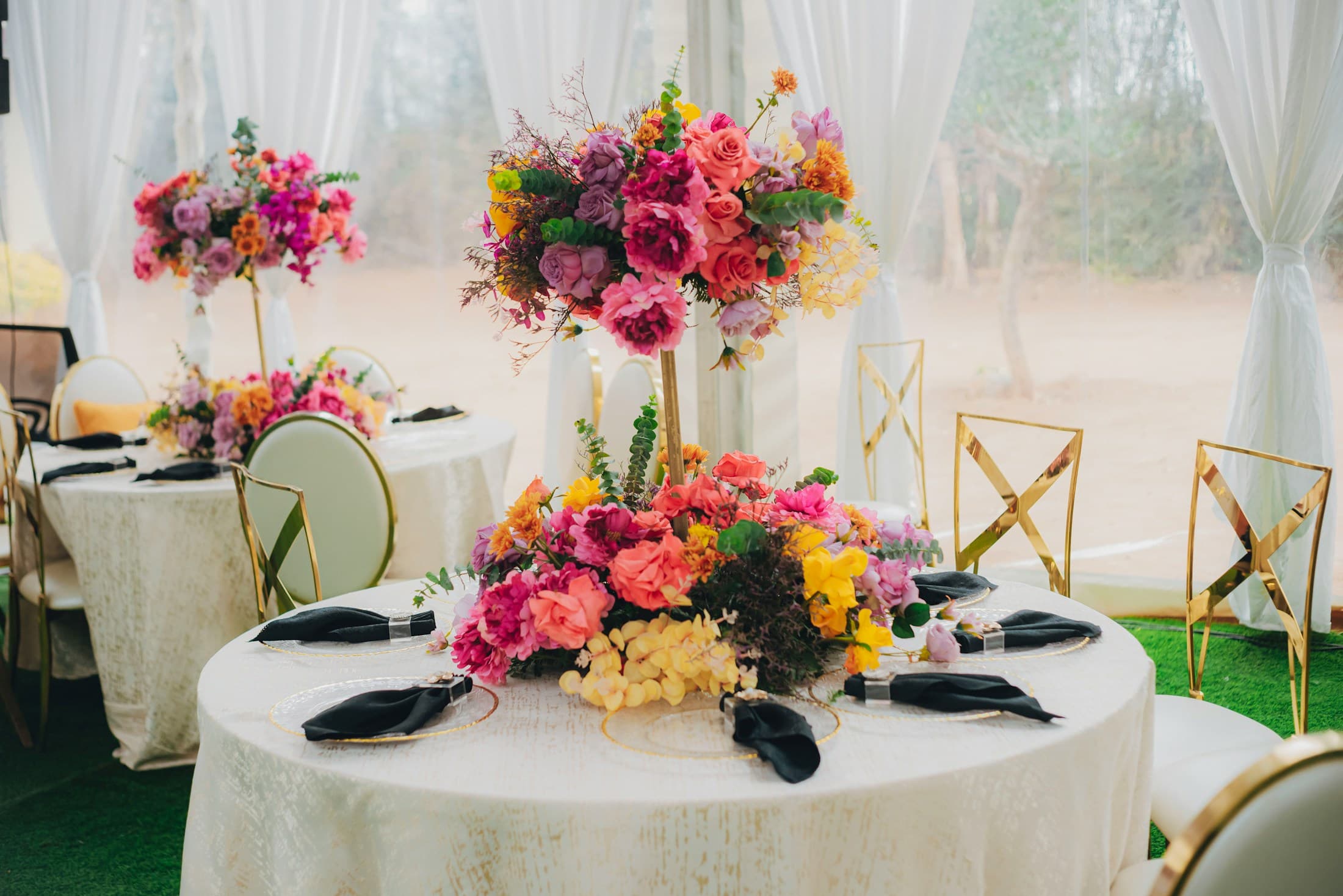 Colorful floral centerpieces arranged for a stylish market table